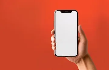 Hand holding smartphone showing mobile-optimized web content