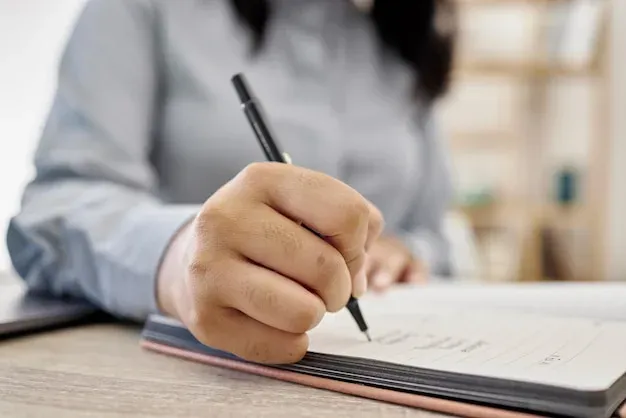 Notebook and pen on desk for planning and note-taking