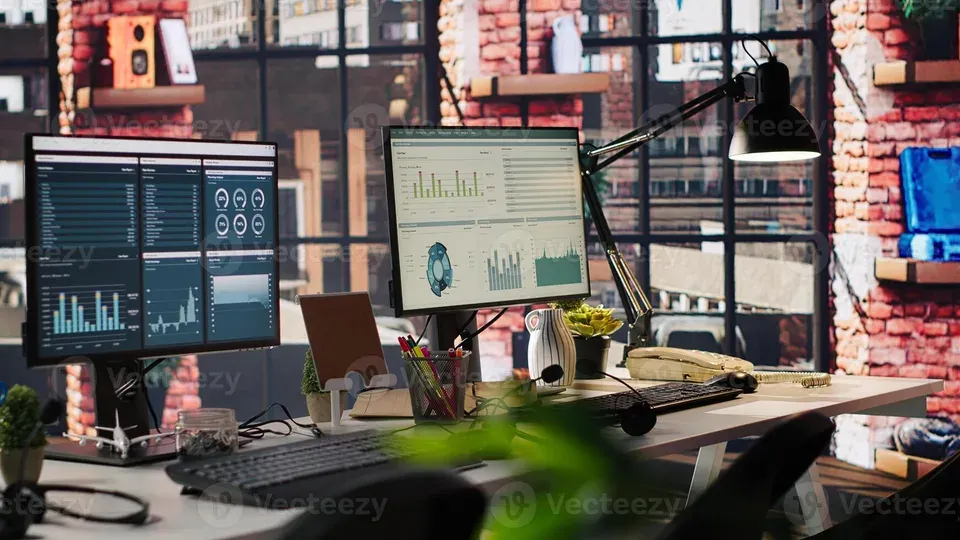 Computer monitor displaying analytics dashboard on workspace