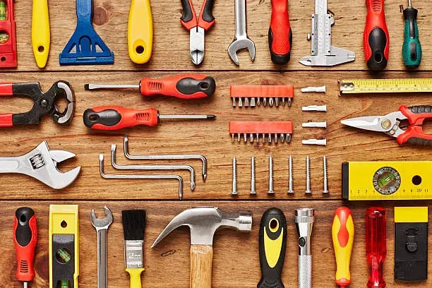 Flat lay arrangement of various tools representing SEO toolkit