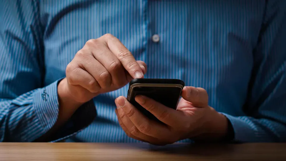 Person using smartphone for online search and research