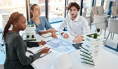 Business team collaborating and discussing strategy in meeting