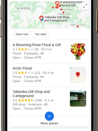 Smartphone showing Google Maps with local business listings and map pack