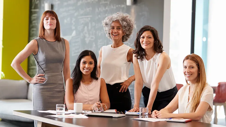 Diverse women professionals networking and collaborating together