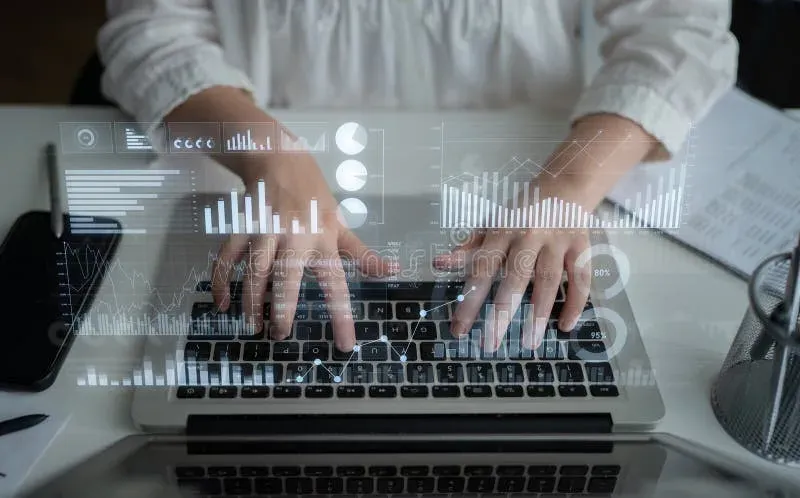 Person typing on laptop with SEO analytics dashboard visible