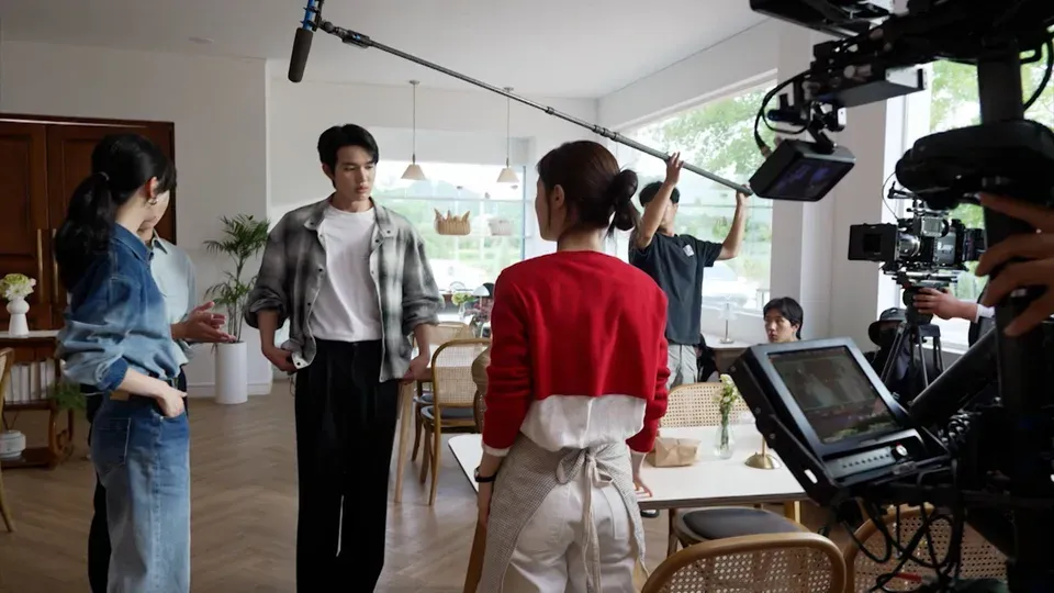 Behind-the-scenes Korean drama production set with cameras and crew