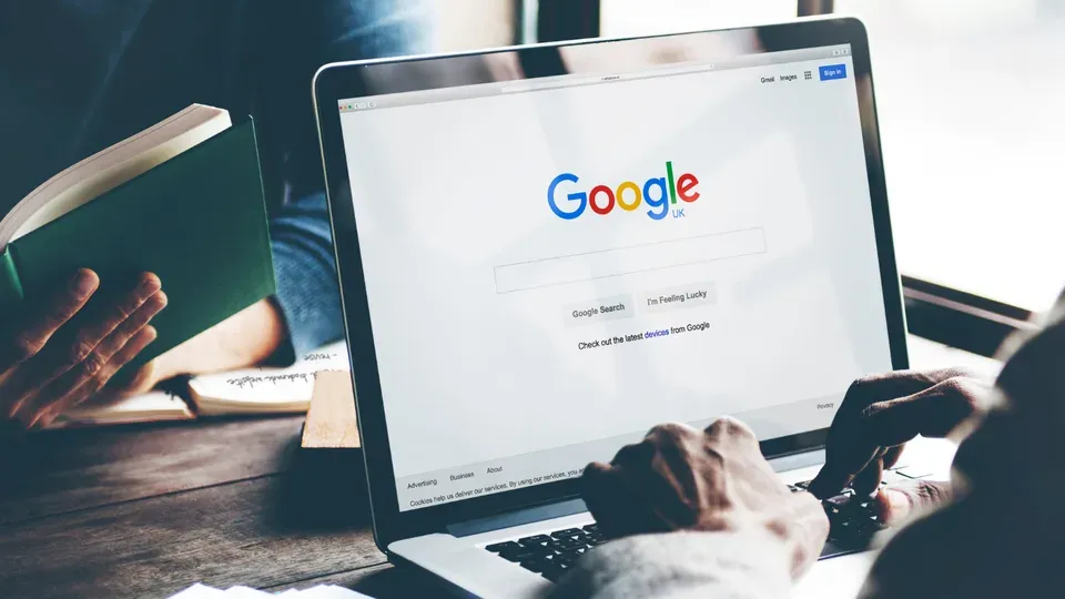 Laptop screen displaying search engine results page with organic listings