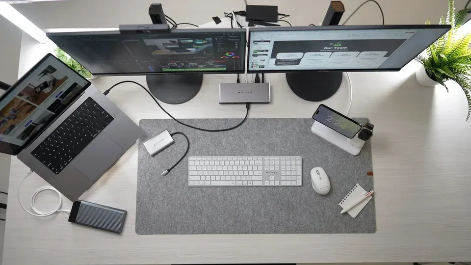 Overhead view of a clean desk workspace with laptop and planning materials