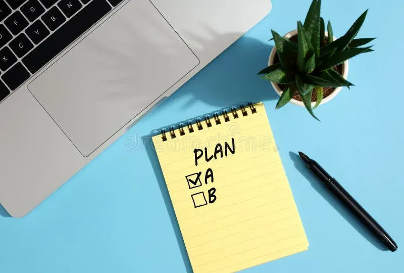 Planning materials including notebook and pen on desk surface