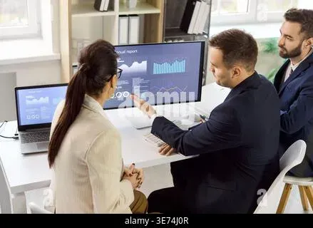 Business team collaborating and reviewing analytics data during a strategy meeting