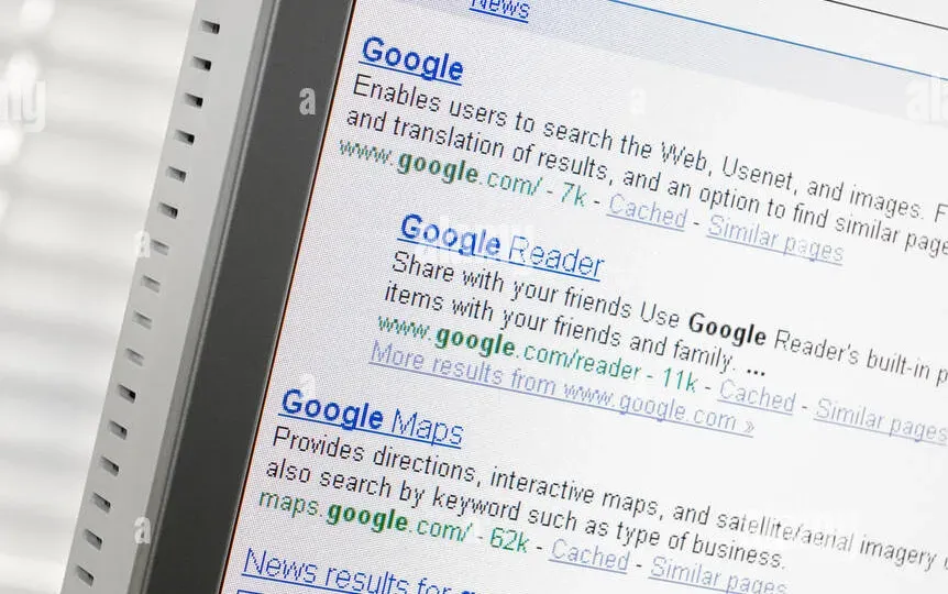 Desktop computer displaying search engine results page with organic listings