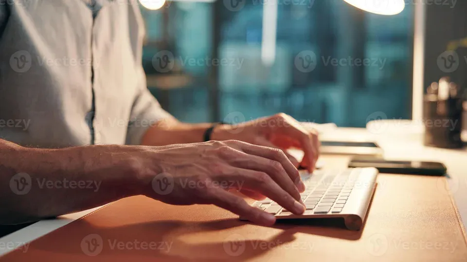Person working at laptop in professional workspace environment